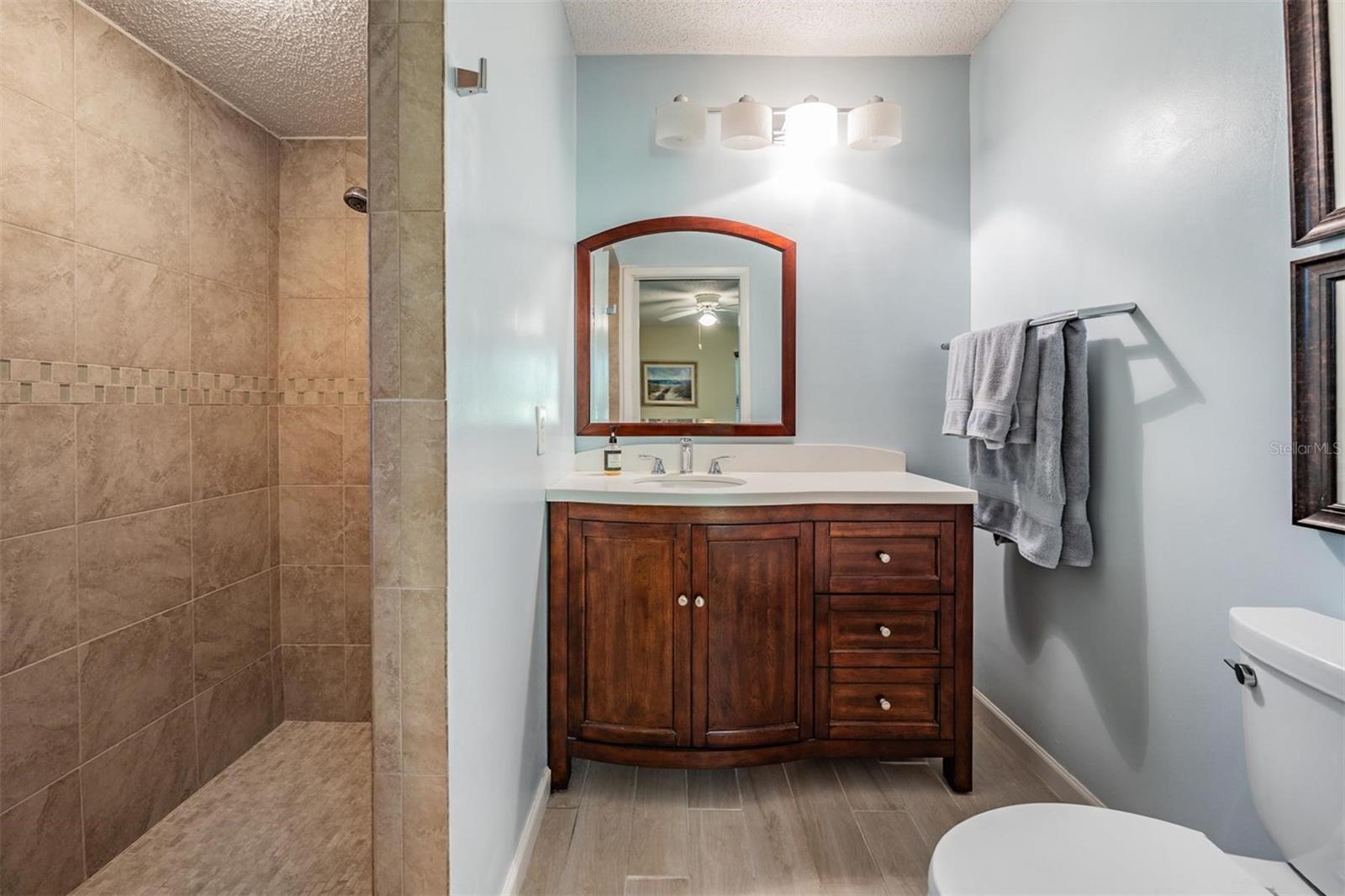 Walk-in shower with updated vanity