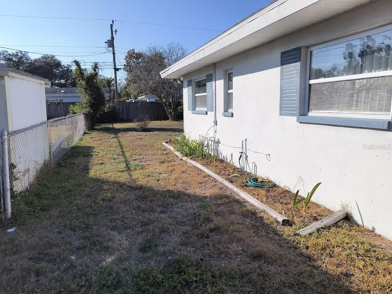 Enter the backyard from the Southside of Home