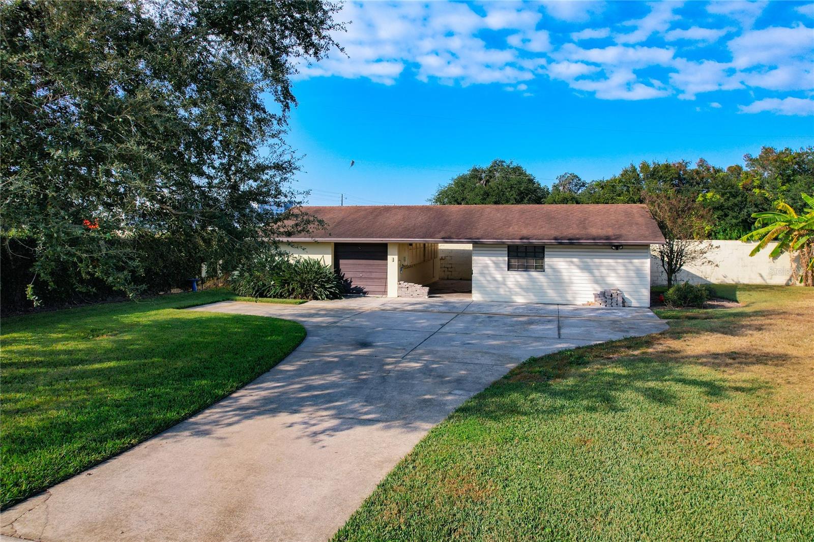 Single car garage and workshop - left of house