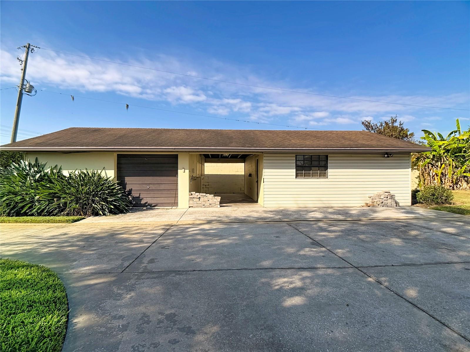 Single car garage and workshop - left of house