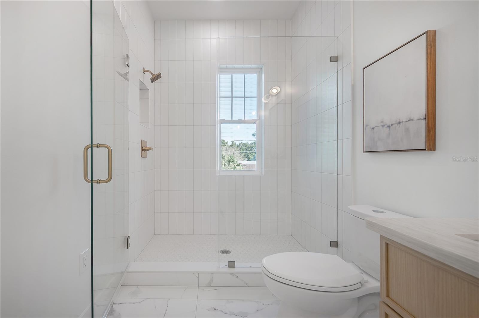 Primary en suite bathroom (upstairs)