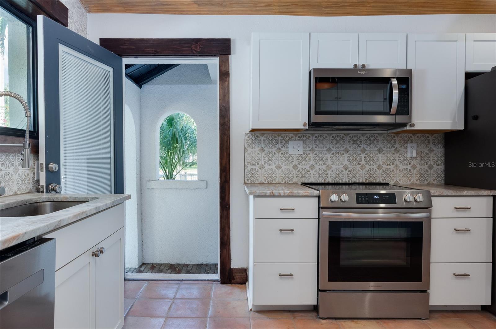Kitchen with side entrance to home