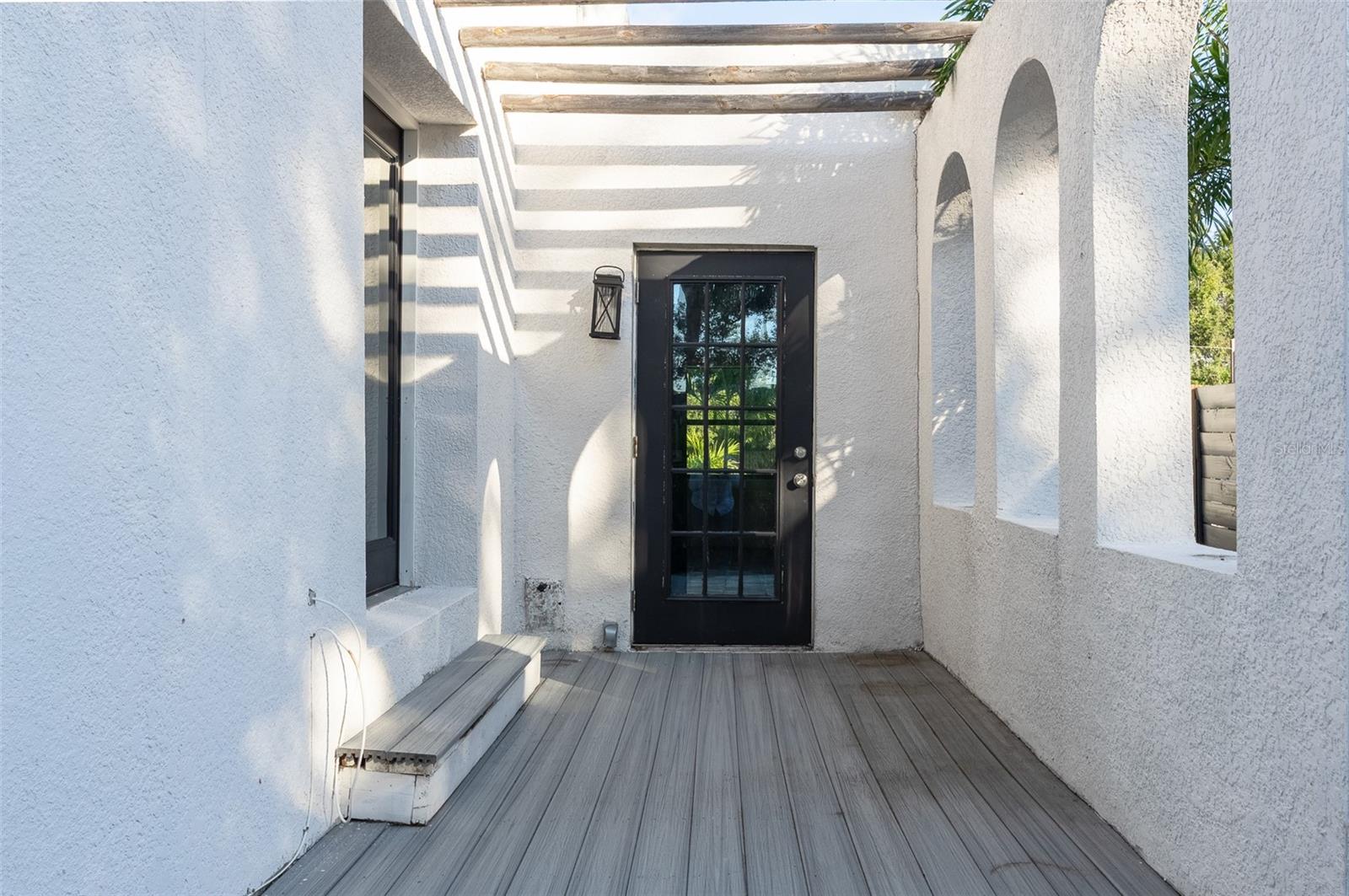 Side patio with access from third room or off dining room