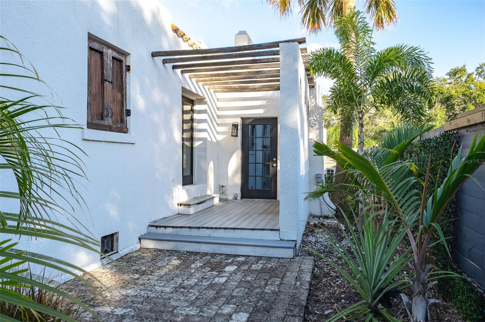 Side patio with access from third room or dining room