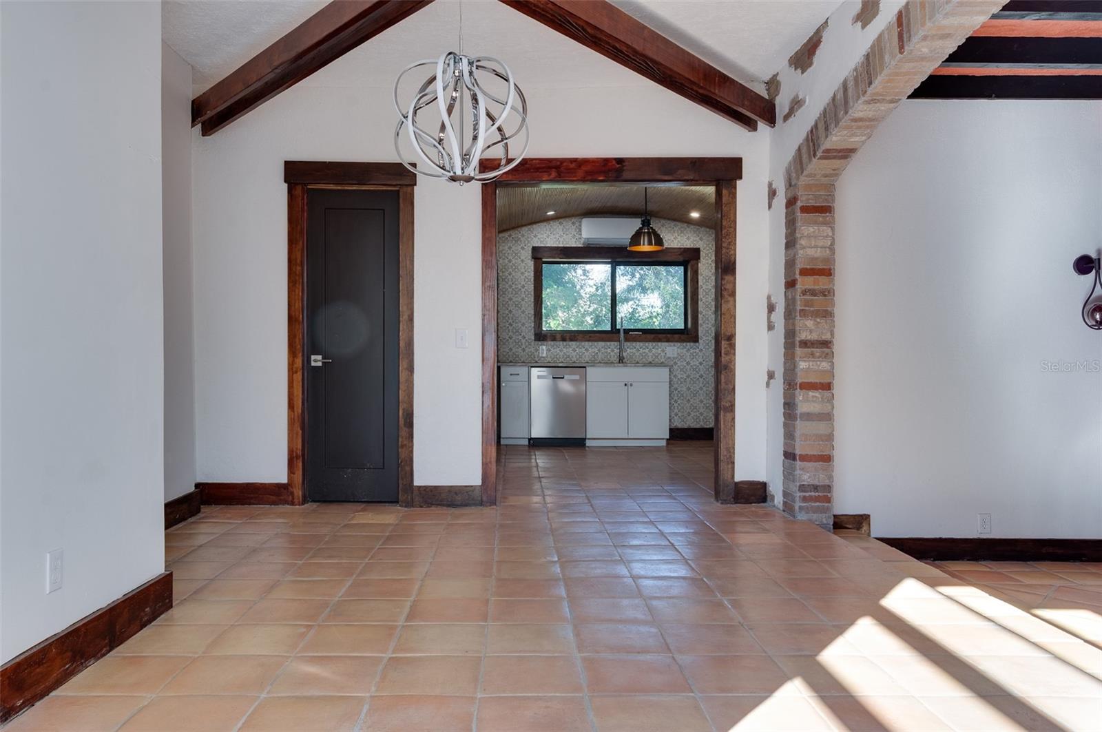 Dining room looking toward kitchen with second bath doorway