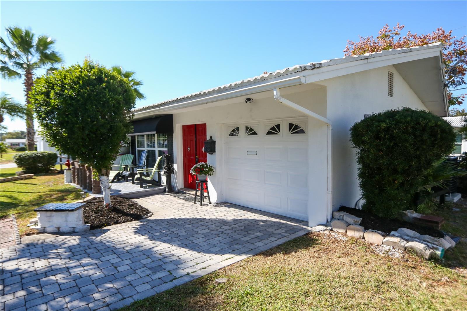 Pavers lead to the 1 Car Garage