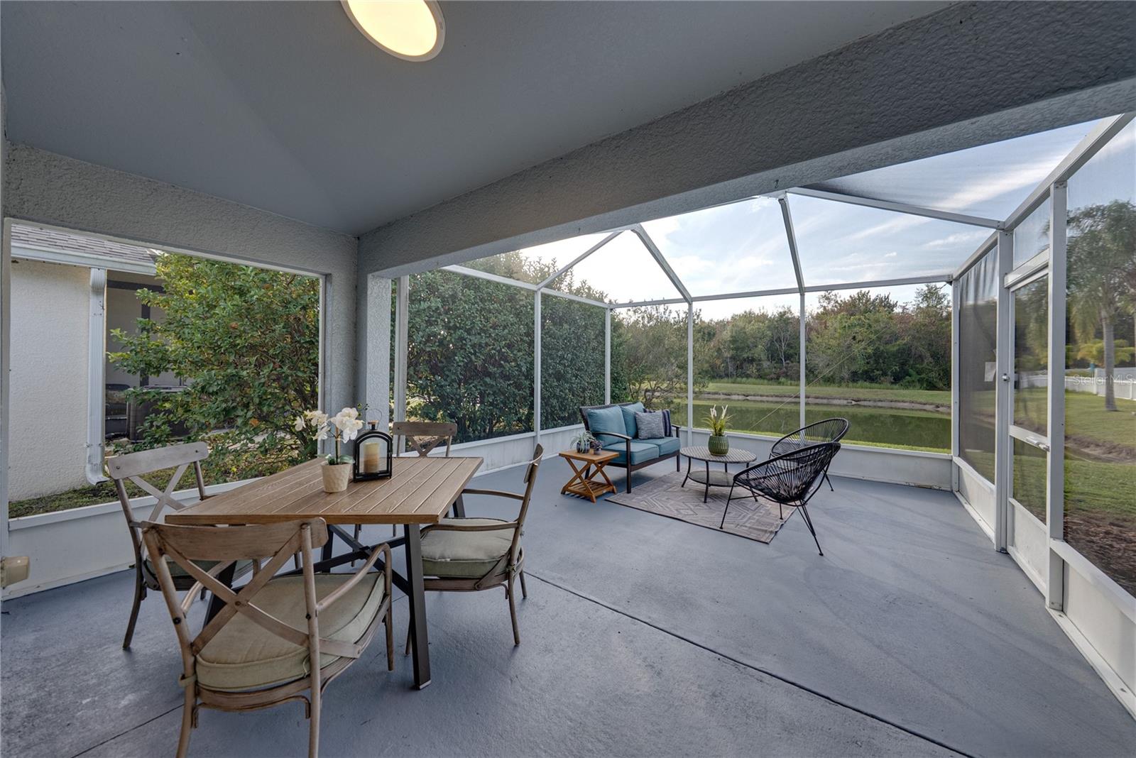 Extended Lanai and Bird Cage Patio on Pond and Conservation Wooded Homesite