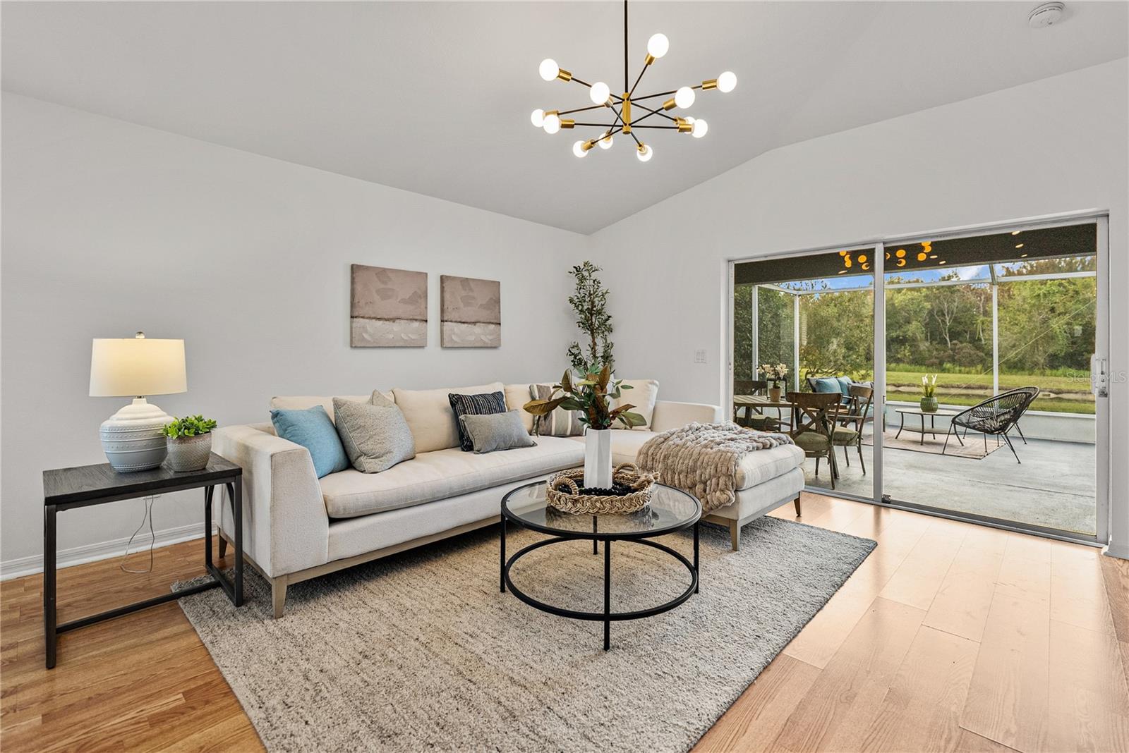 Family Room area with Vaulted Ceilings and Views to Pond and Conservation