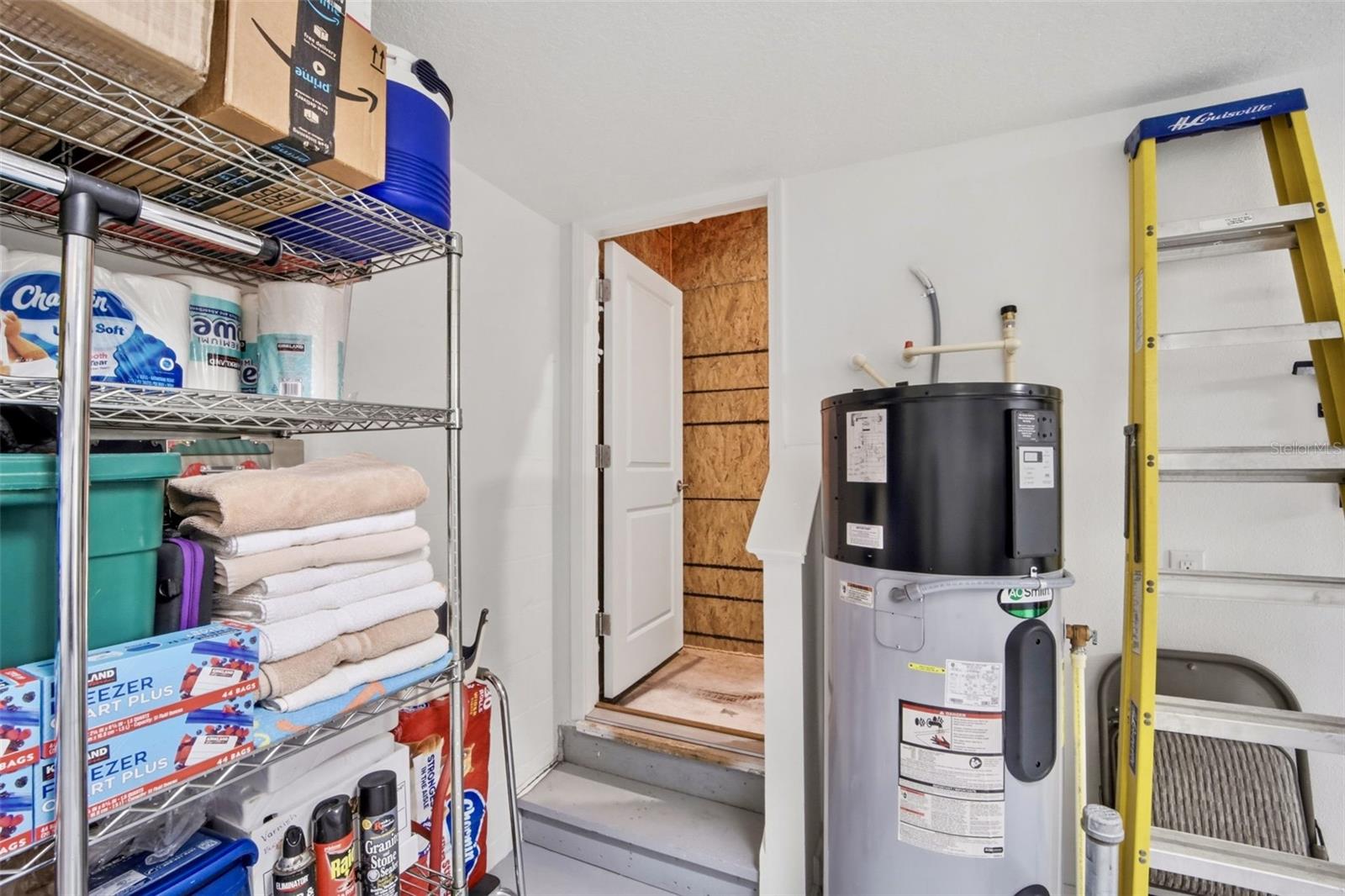 door to enter upstairs storage area