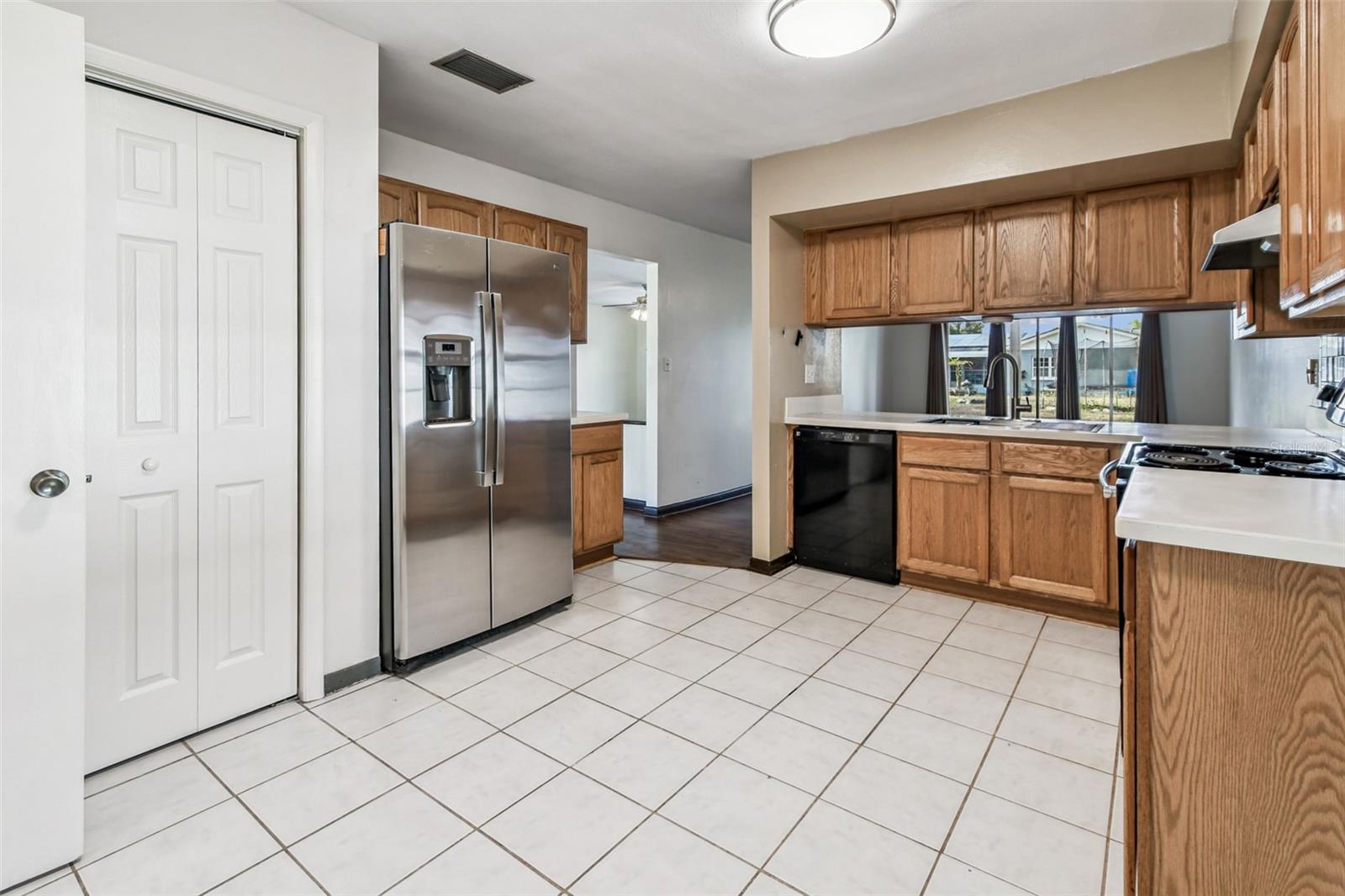 Closet Pantry and Stainless Steel Refrigerator