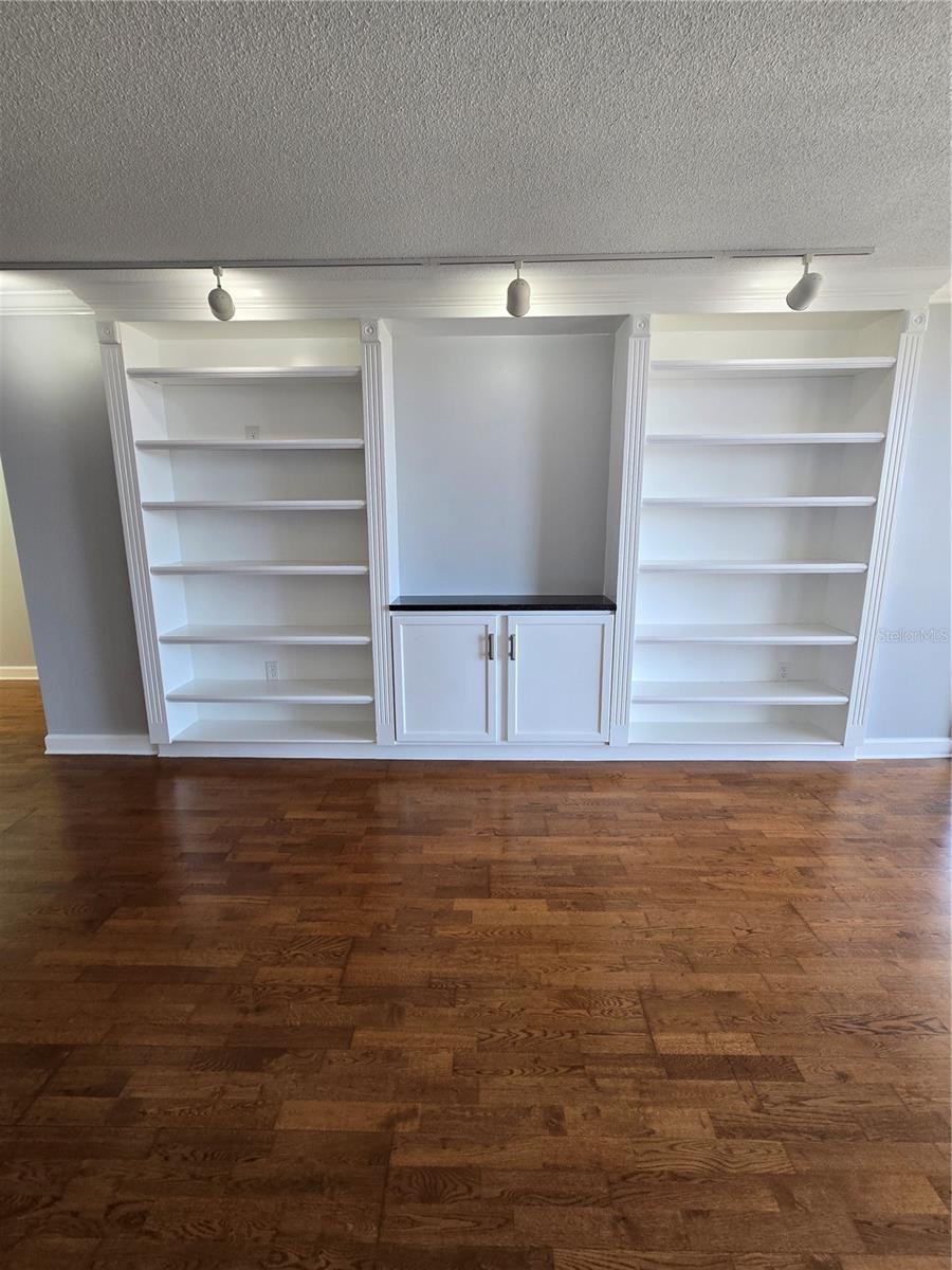 custom built in shelves and cabinet