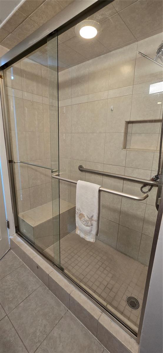 tile shower with bench and dual shower heads