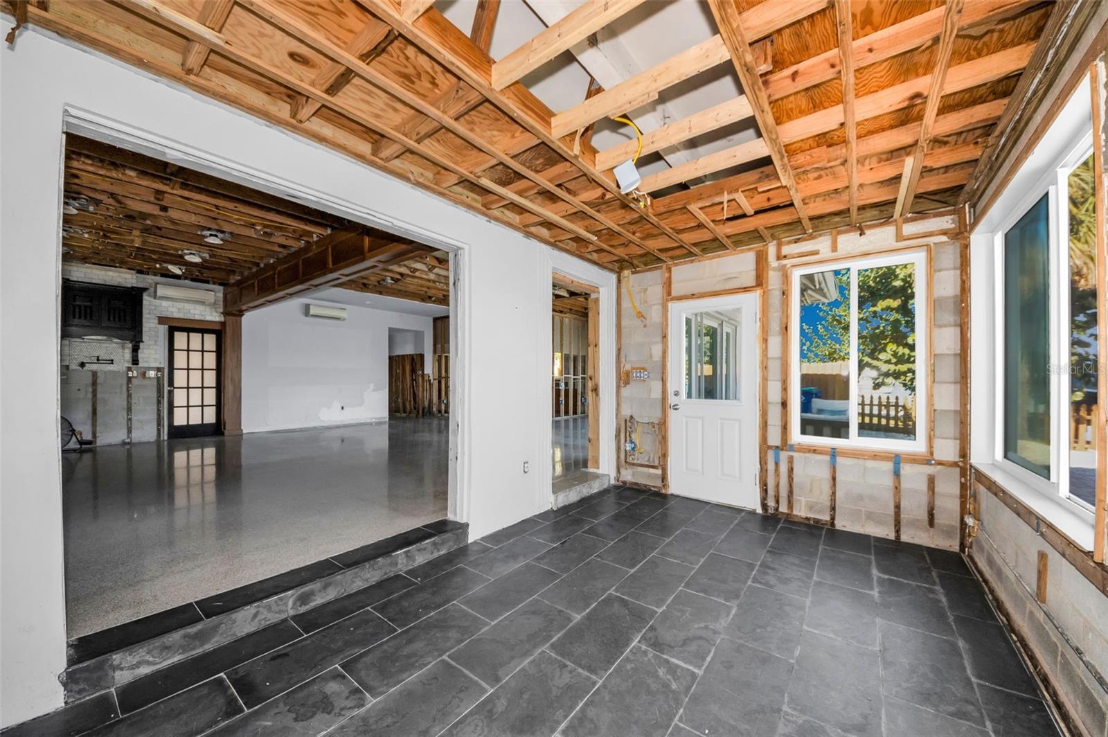 Open to living area to be part of the action or quietly away.