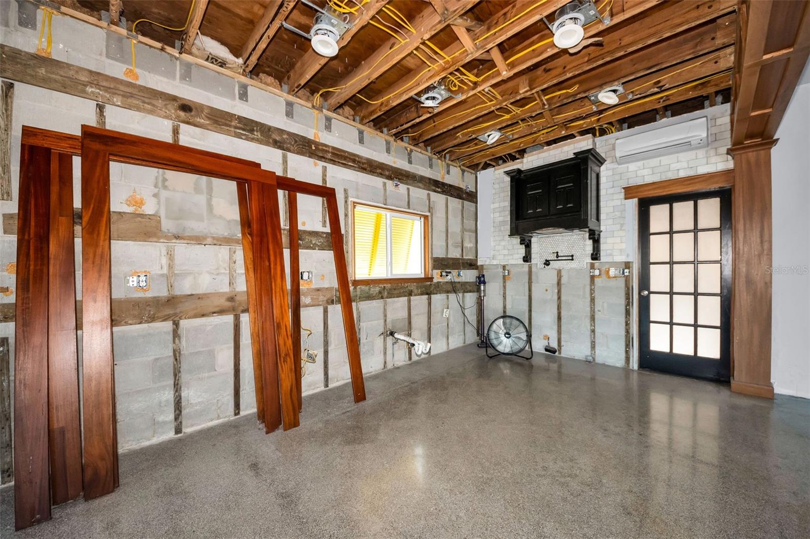 The kitchen space is wide open with natural light and 9.5 ft ceilings.