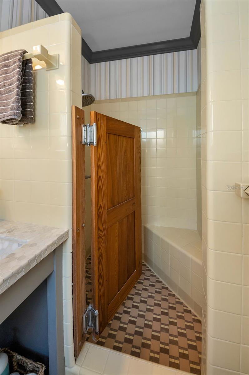 Shower with bench seating.