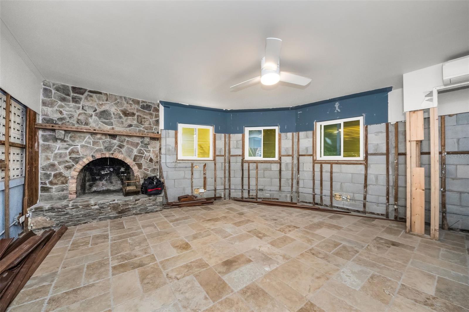 Sizable fourth bedroom with wood burning stone fireplace.