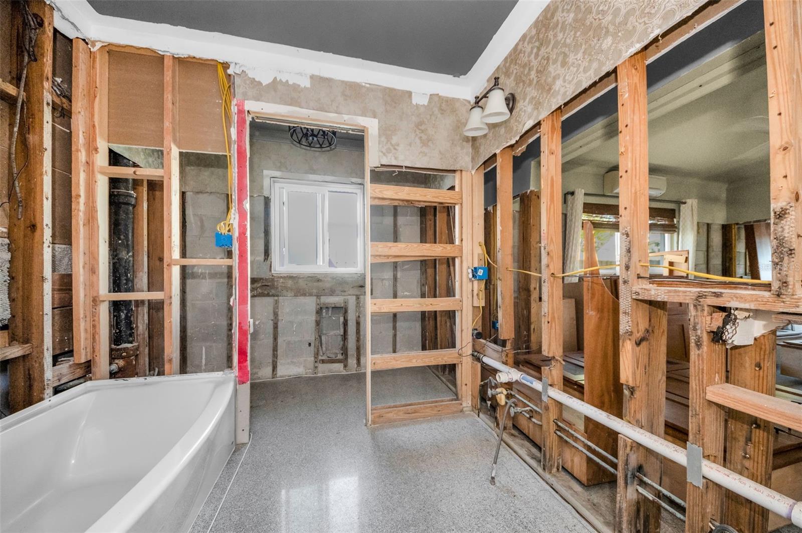 Spacious guest bathroom with privacy room.