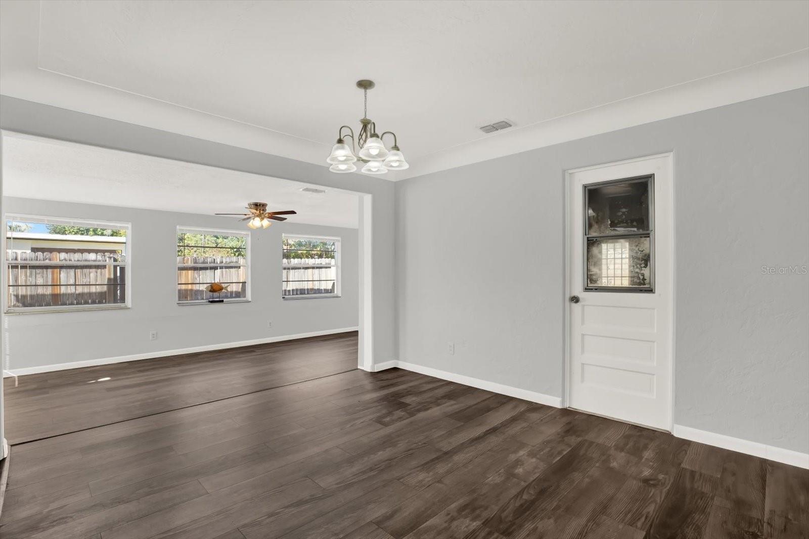Dining room area connecting to the living room and family room , Plenty of open space .