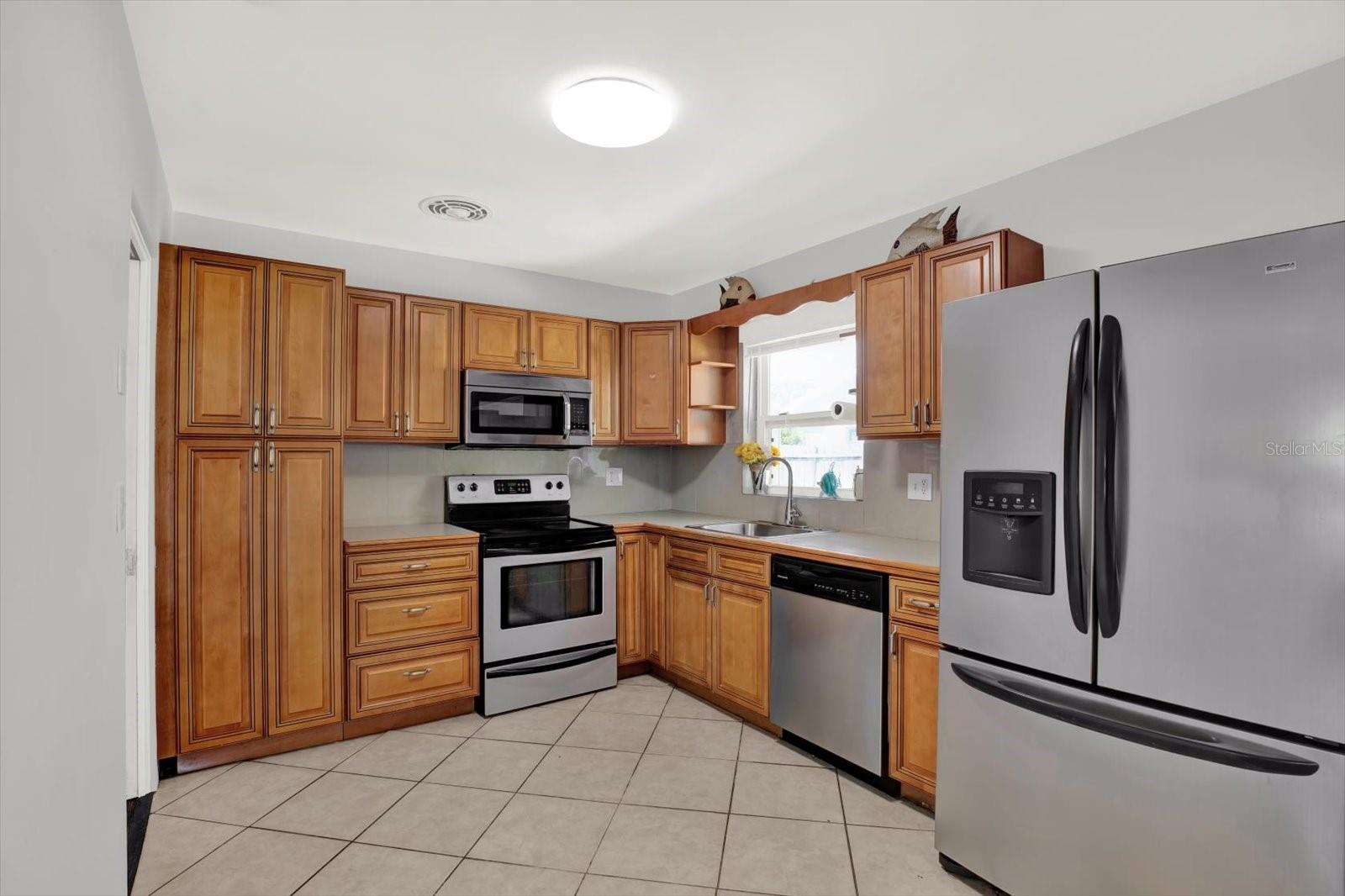 Beautiful kitchen with plenty of cabinet space with room for a kichen table.