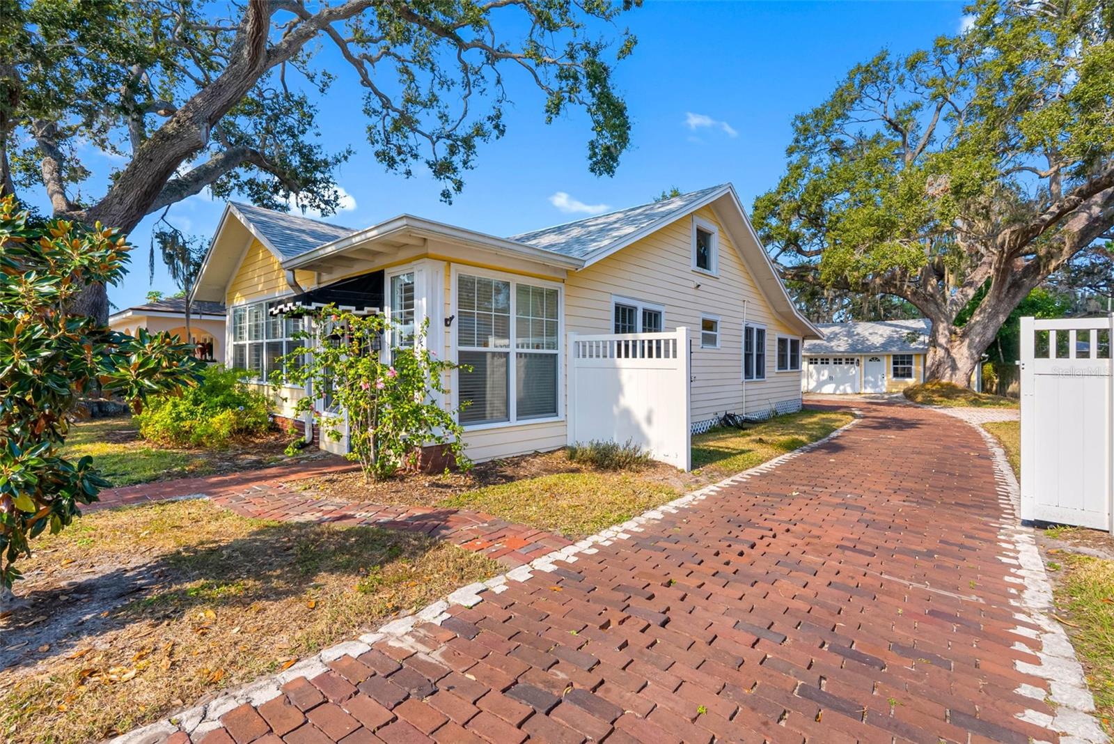 Brick Driveway secured fence