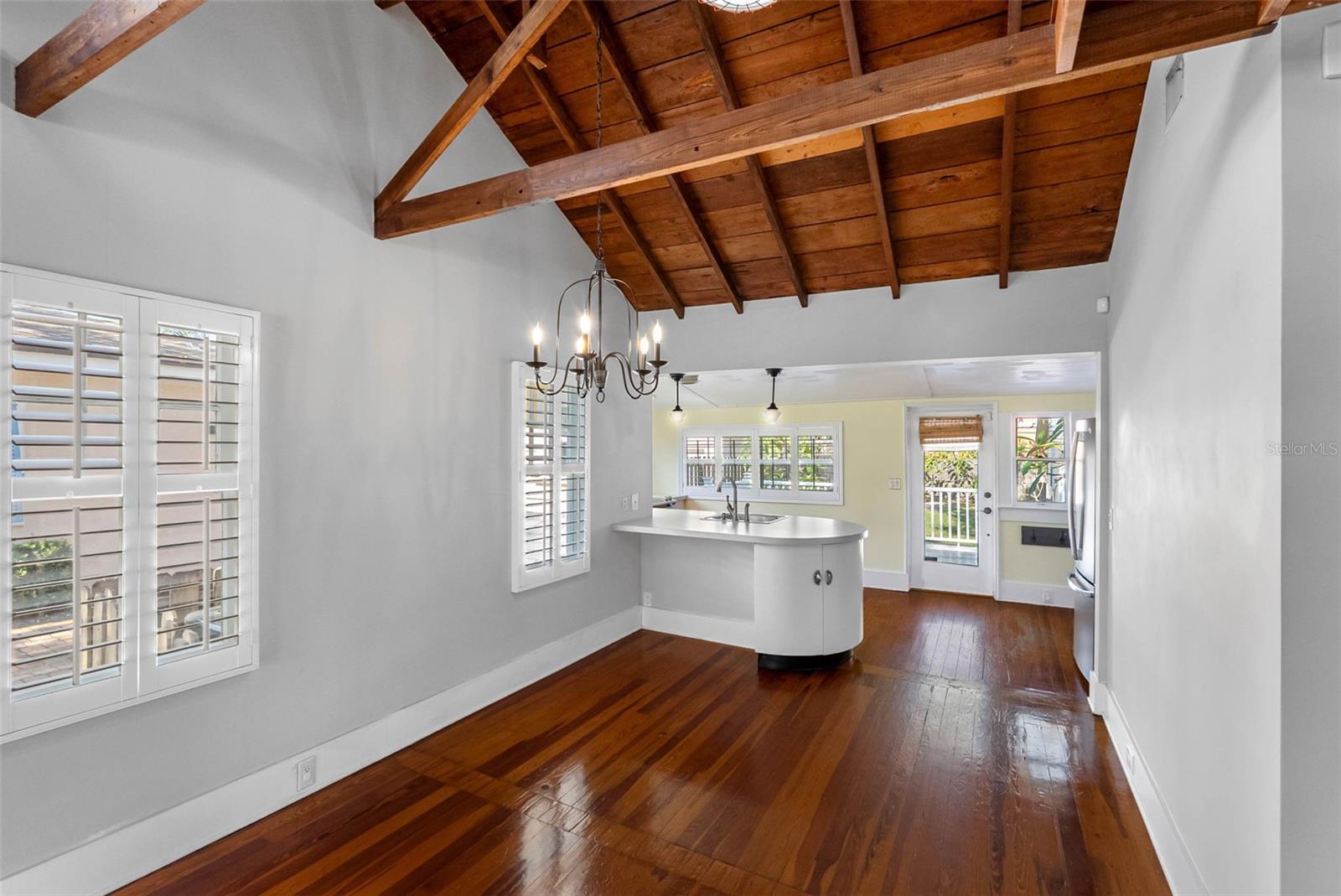 Dining Area Kitchen with back door and lots of windows