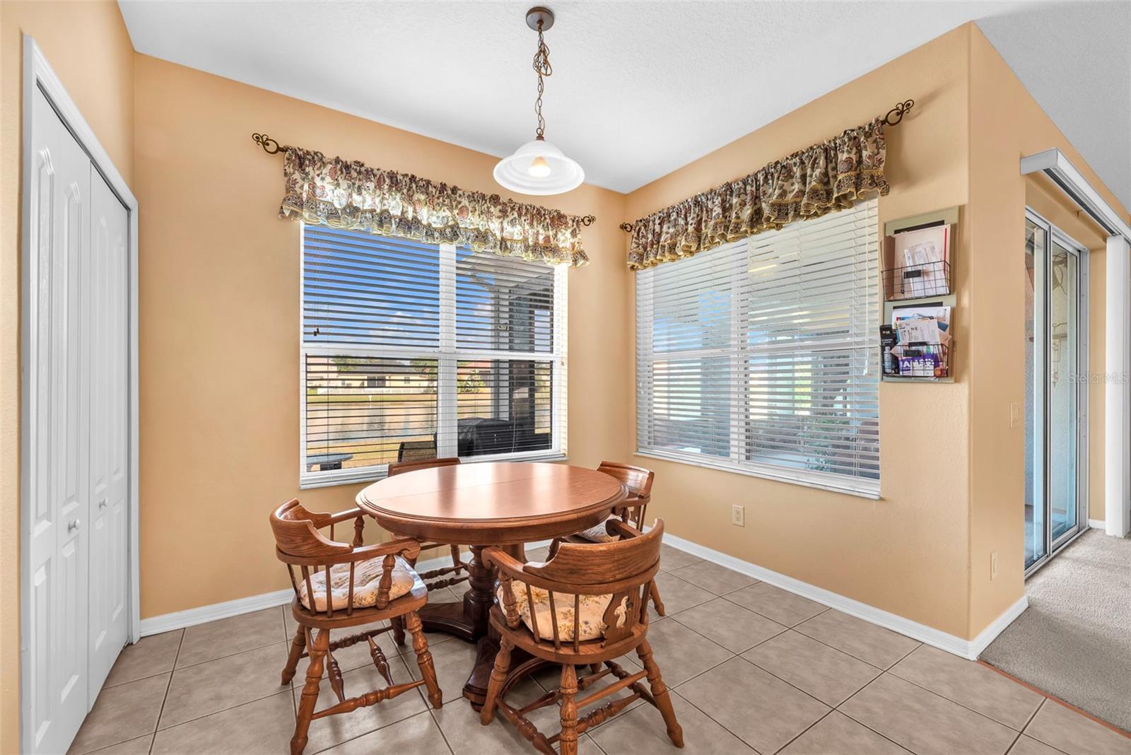 Eat in area for casual dining in the kitchen overlooking the serene pond view.