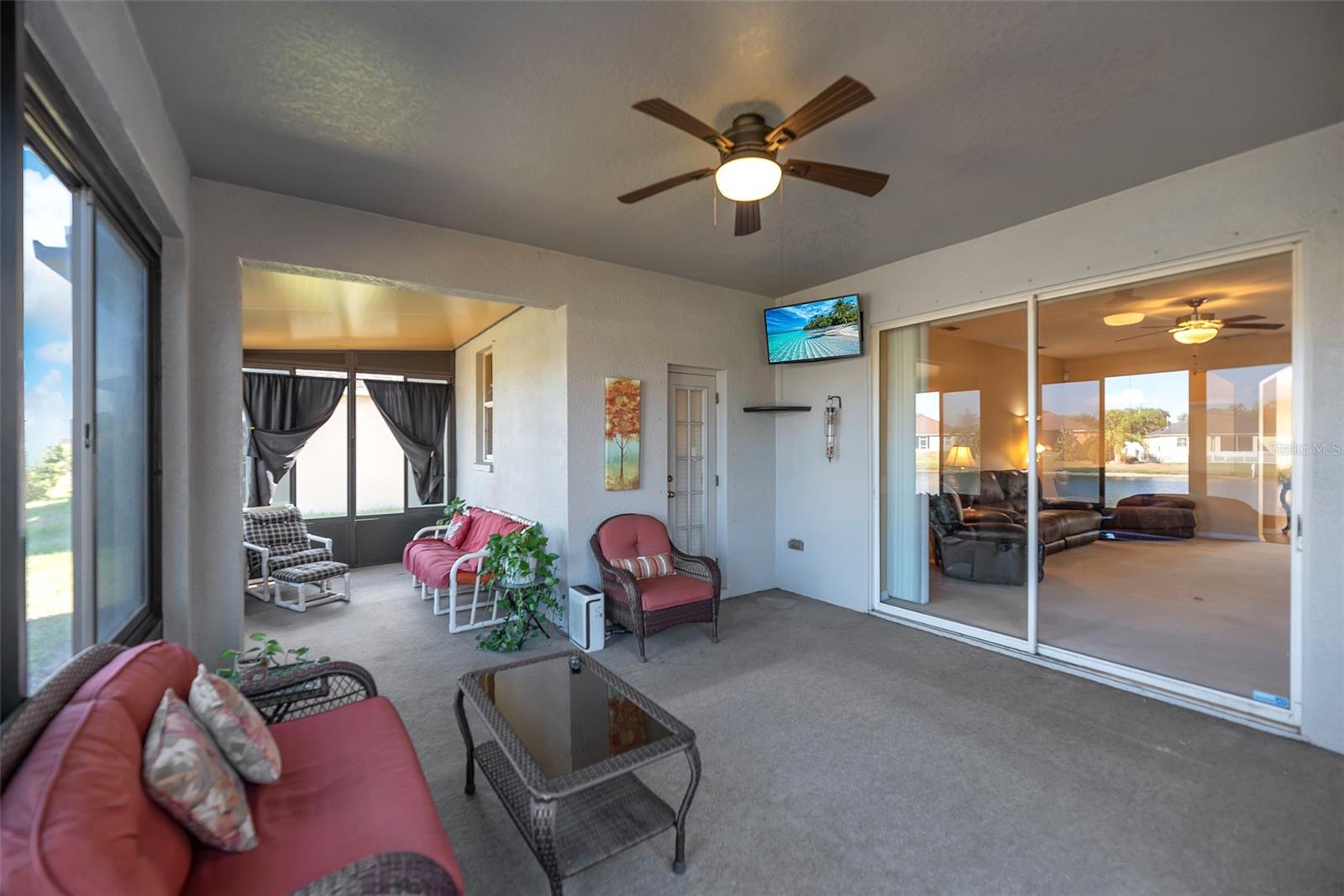 Enjoy outdoor living in a fully glassed-in Florida Room, featuring double-pane sliding windows.