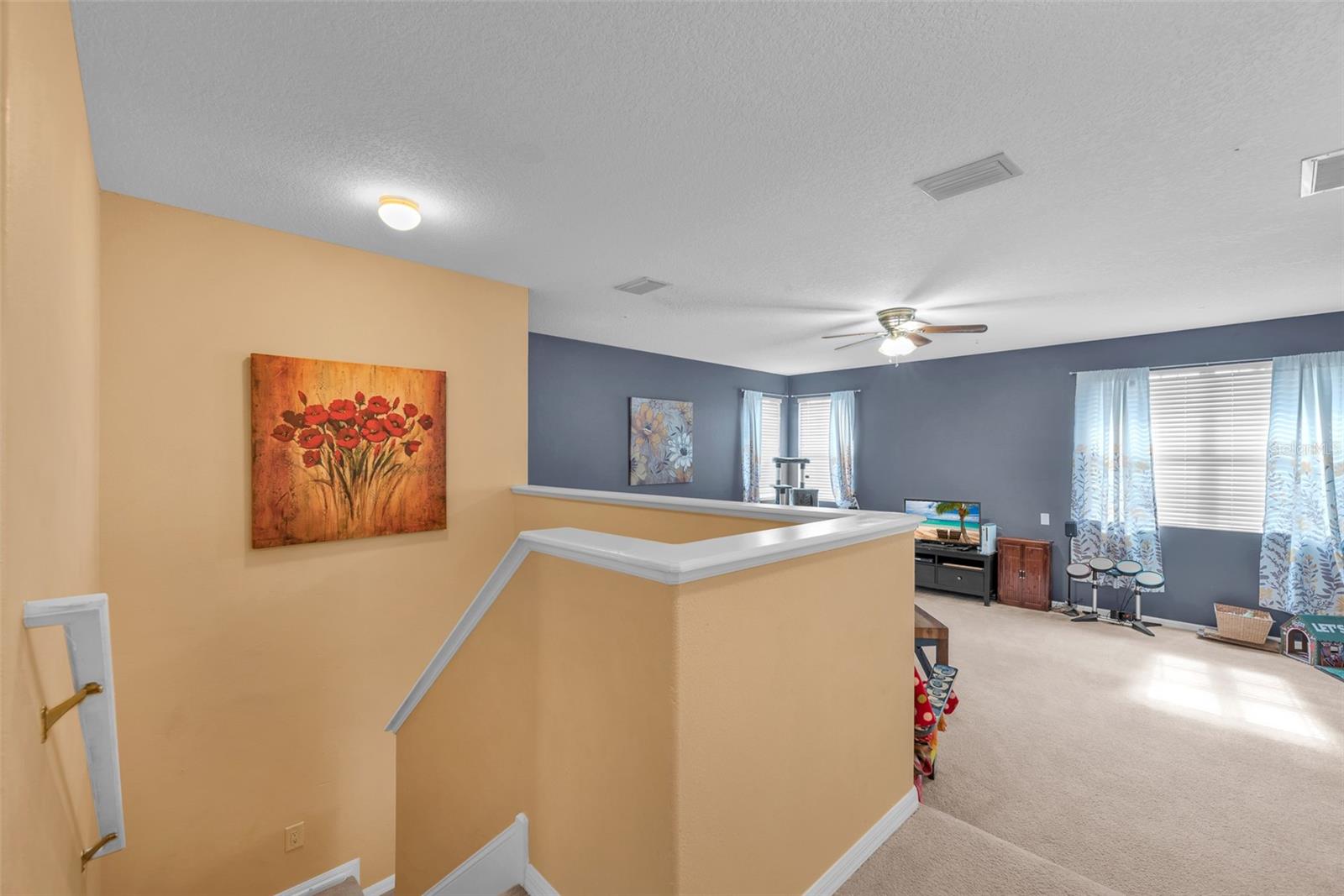 Upstairs there is a large Bonus Room, the primary suite with bathroom, a secondary suite with a bathroom, and 2 additional bedrooms sharing a full bathroom.