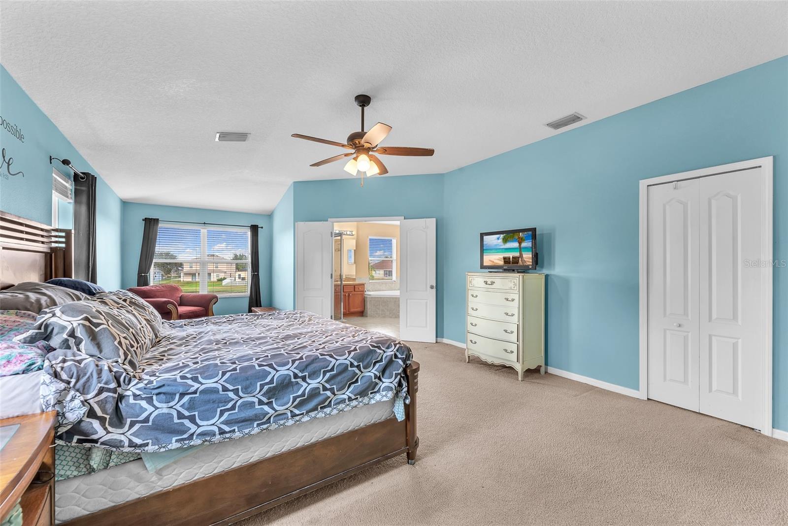 The oversized primary suite offers a large walk-in closet and a luxurious attached bathroom.