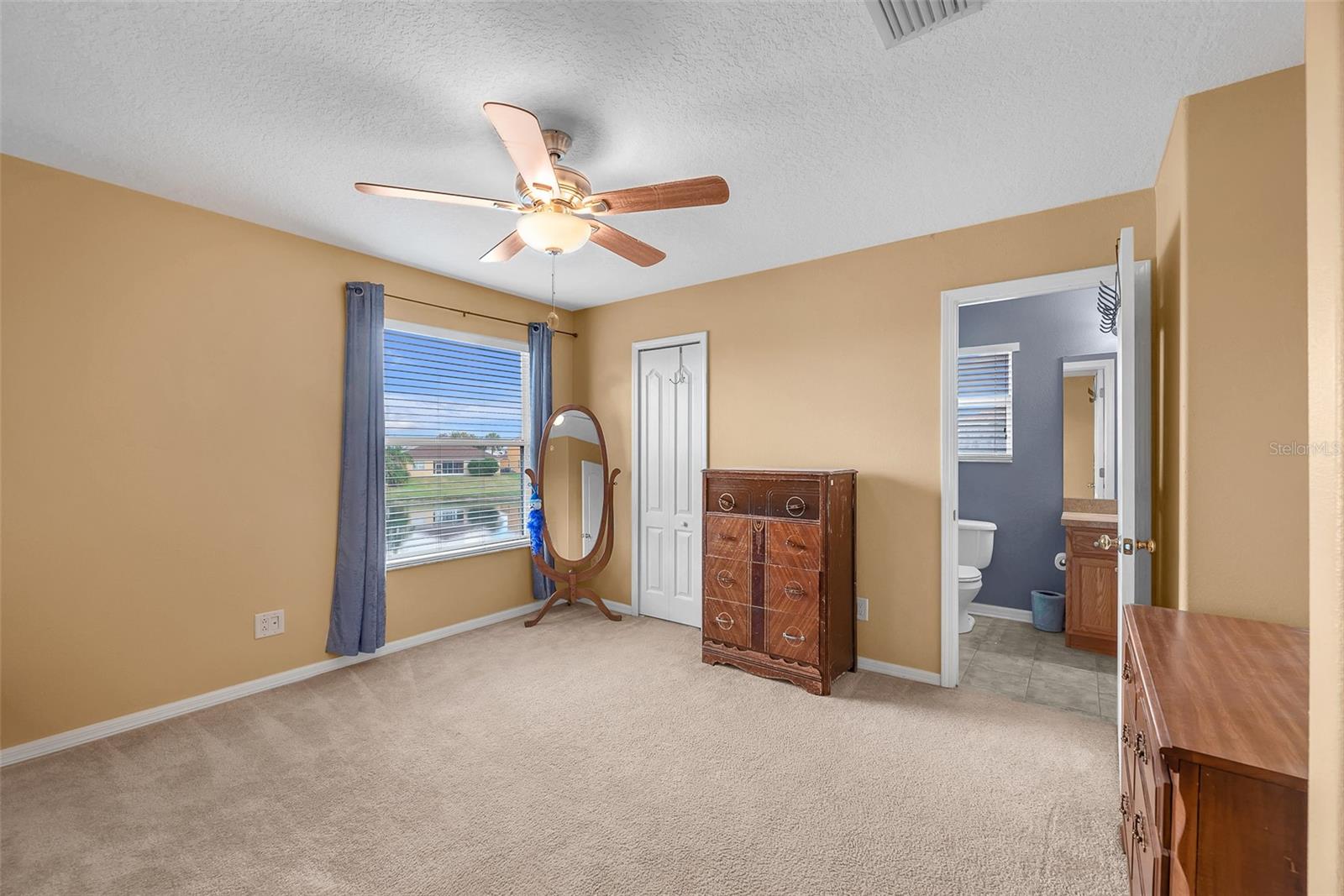 Secondary Bedroom #2  has an attached  bathroom with a tub/shower and a large walk-in closet.