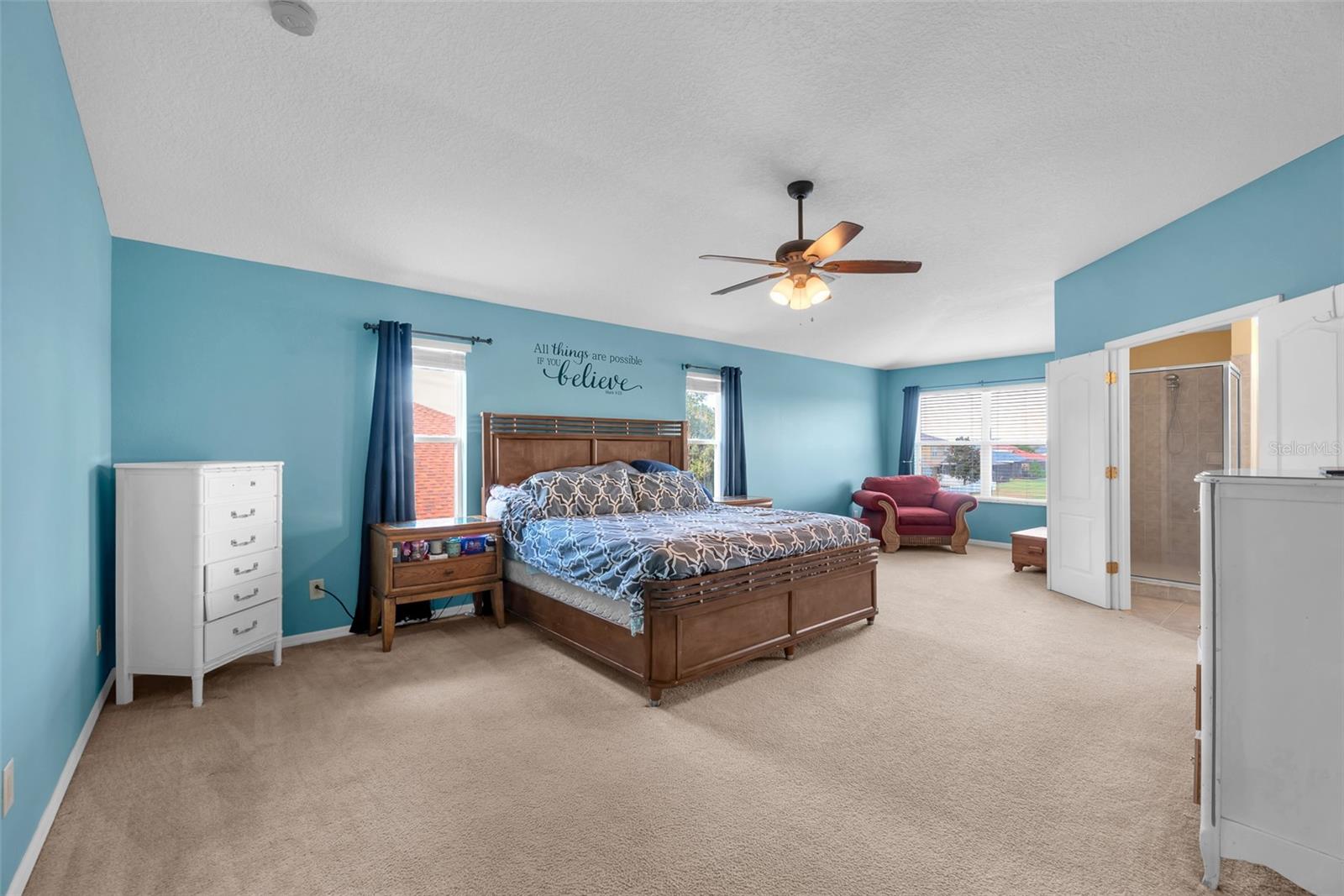 oversized main suite offers plenty of room for a sitting area, a large walk-in closet, and a luxurious bath complete with a garden tub, separate shower, and dual sinks.