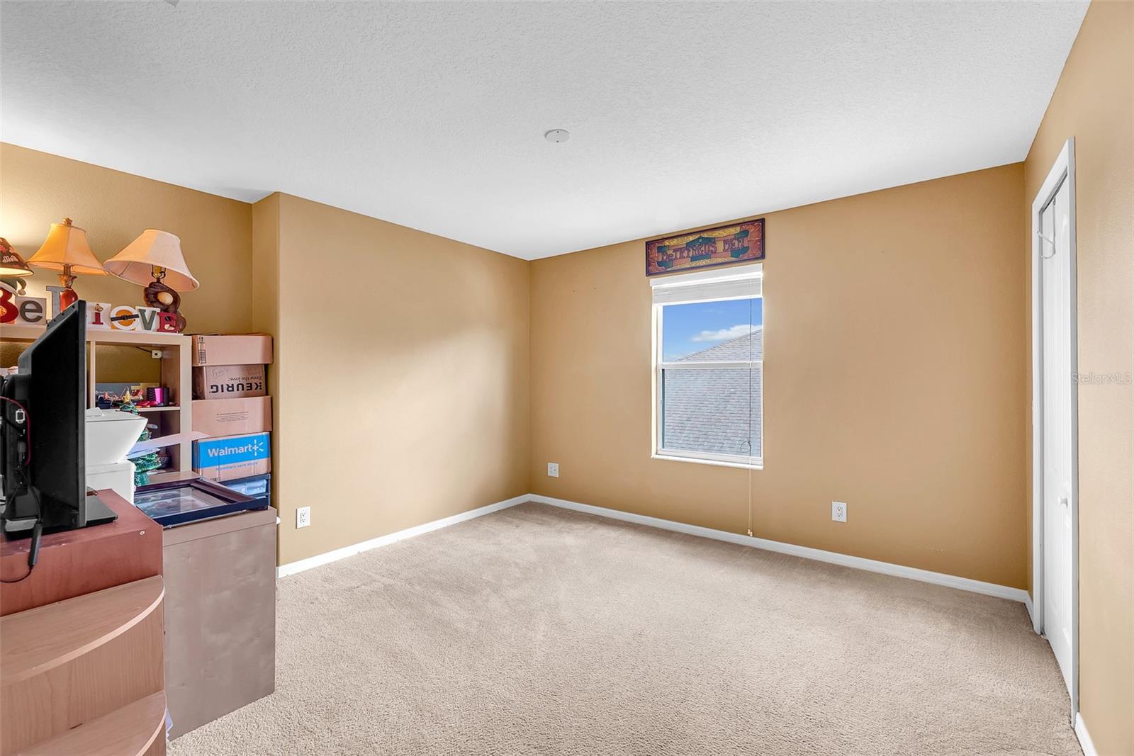 Secondary Bedroom #4 with large walk in closet.