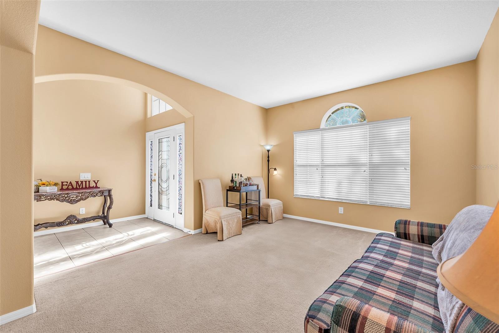 Living room on the left of the Foyer with connection to the Dining room.