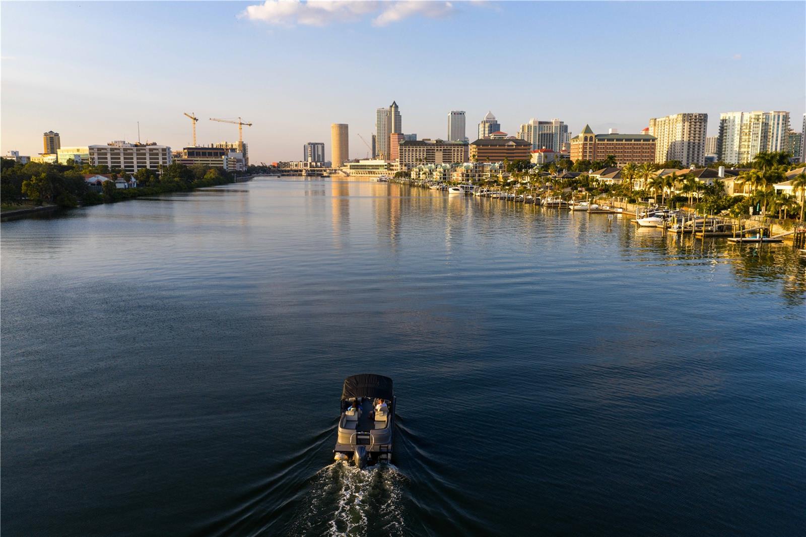 Sail into the sunset or cruise straight into the city—this home offers the best of both worlds