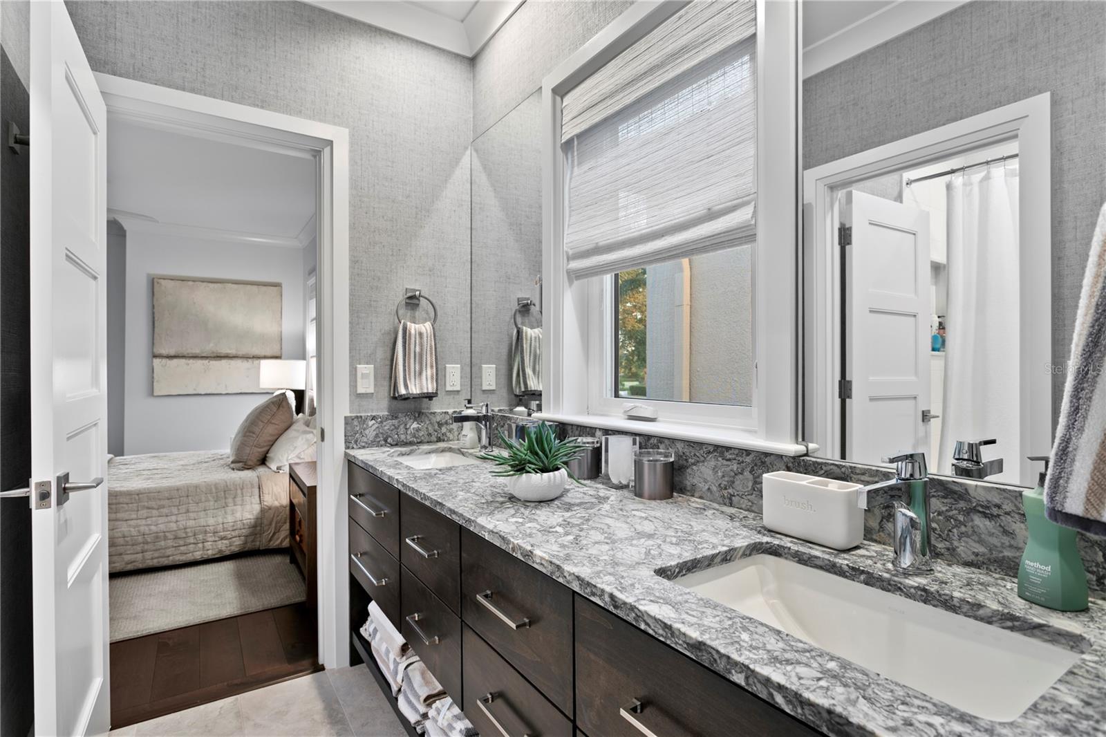 A convenient Jack and Jill bathroom connects the third and fourth bedrooms