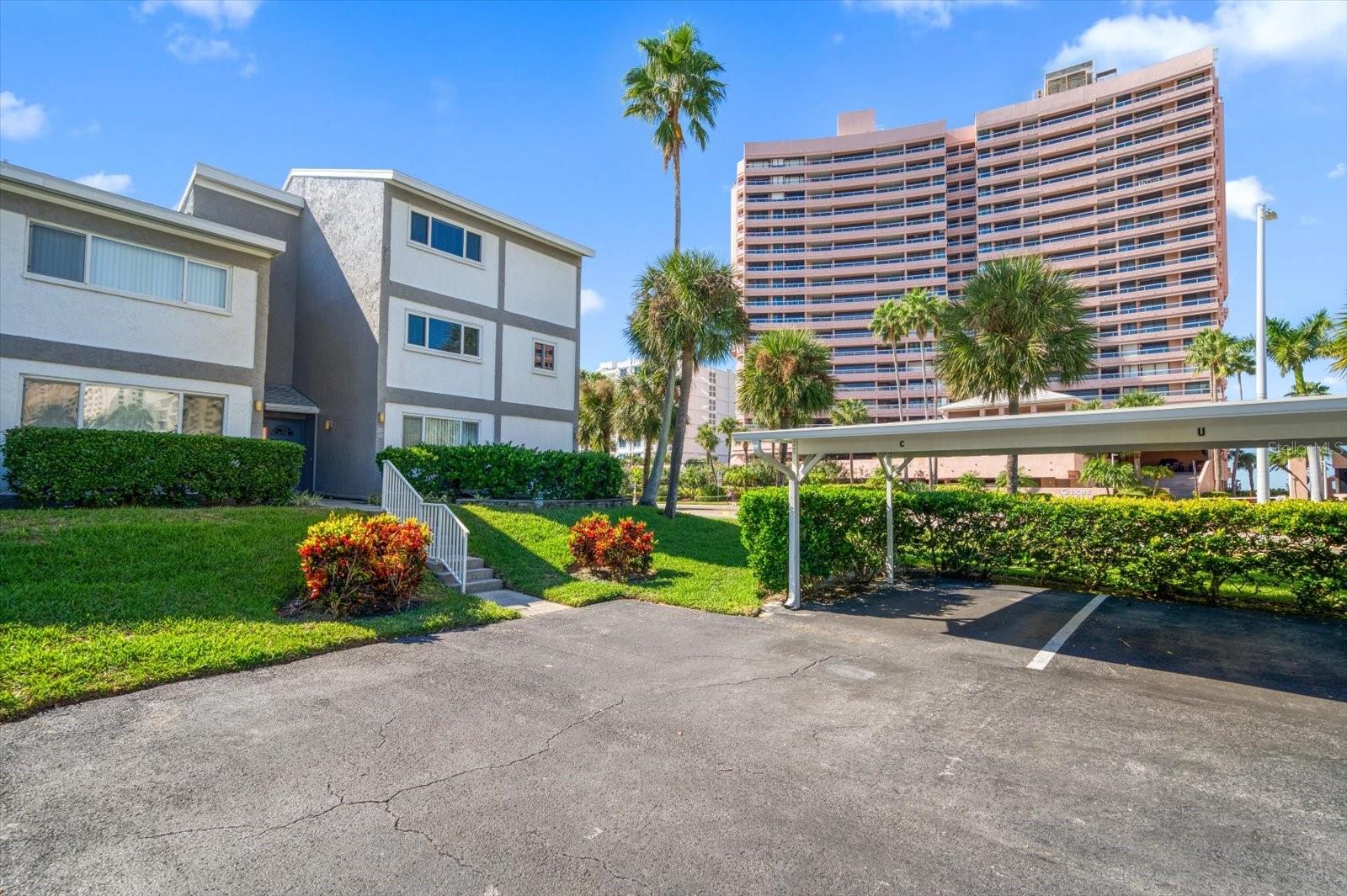 End unit condo with assigned, covered parking