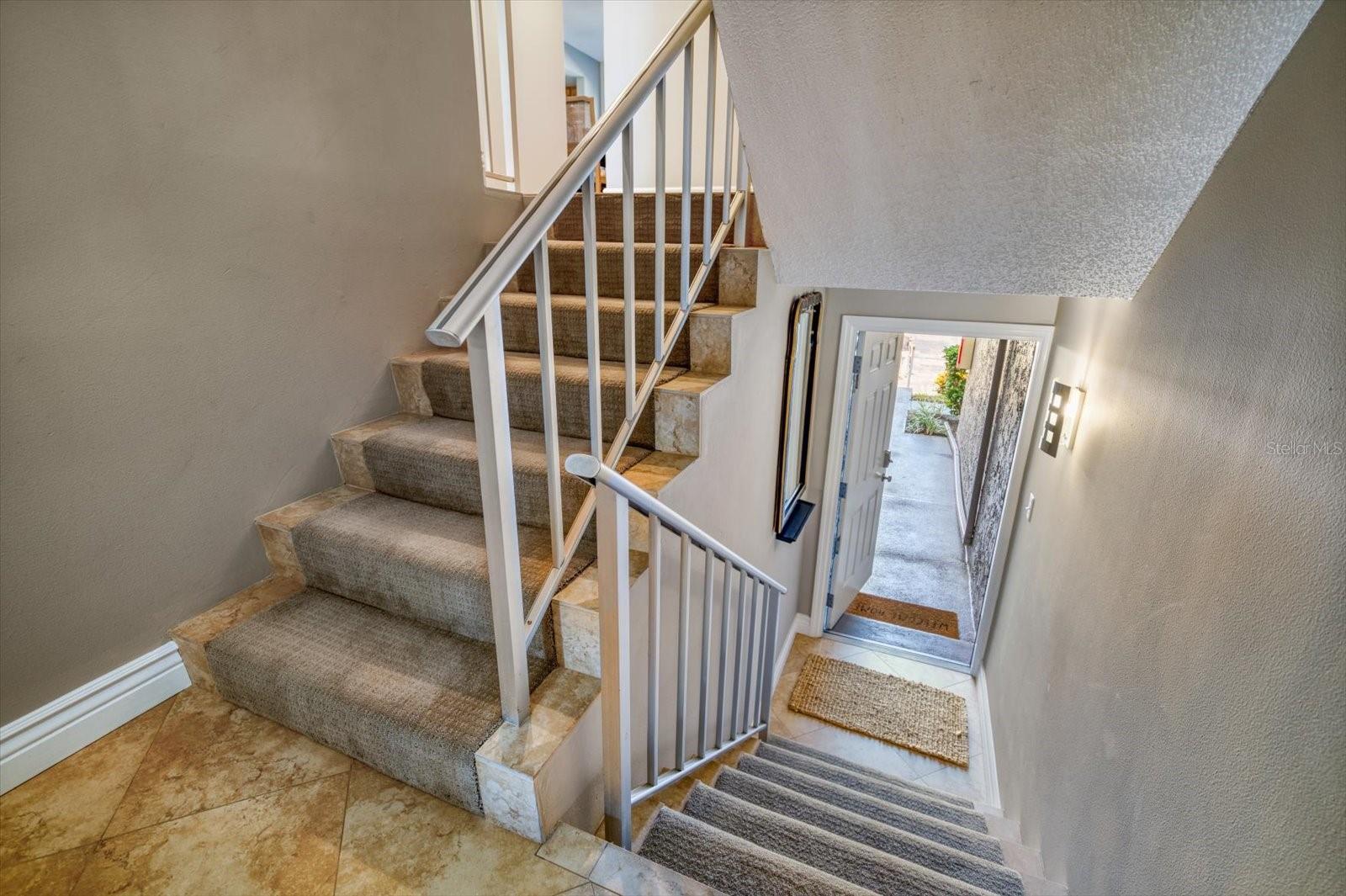 Stairs to the main living area on the second floor