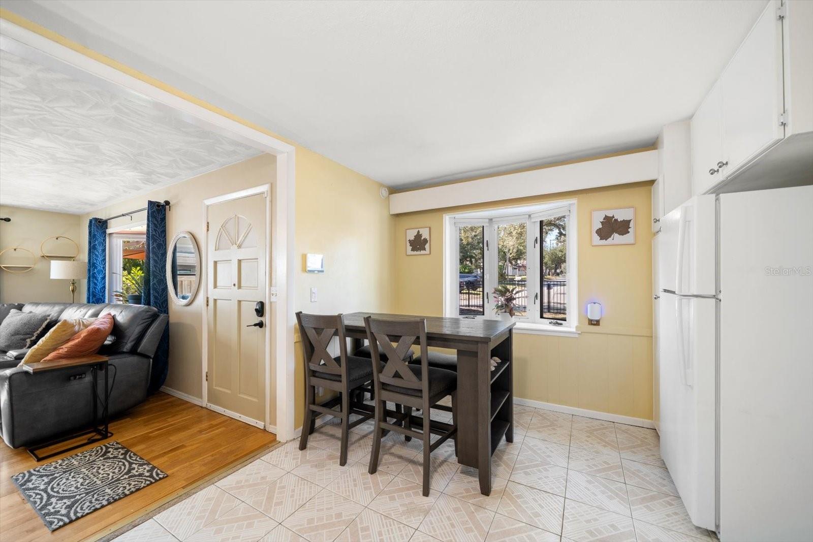 Dining space in kitchen with bay window