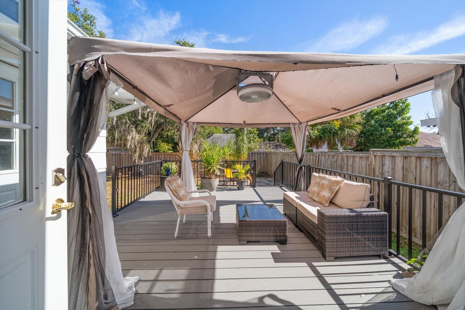 Composite deck in backyard with pergola