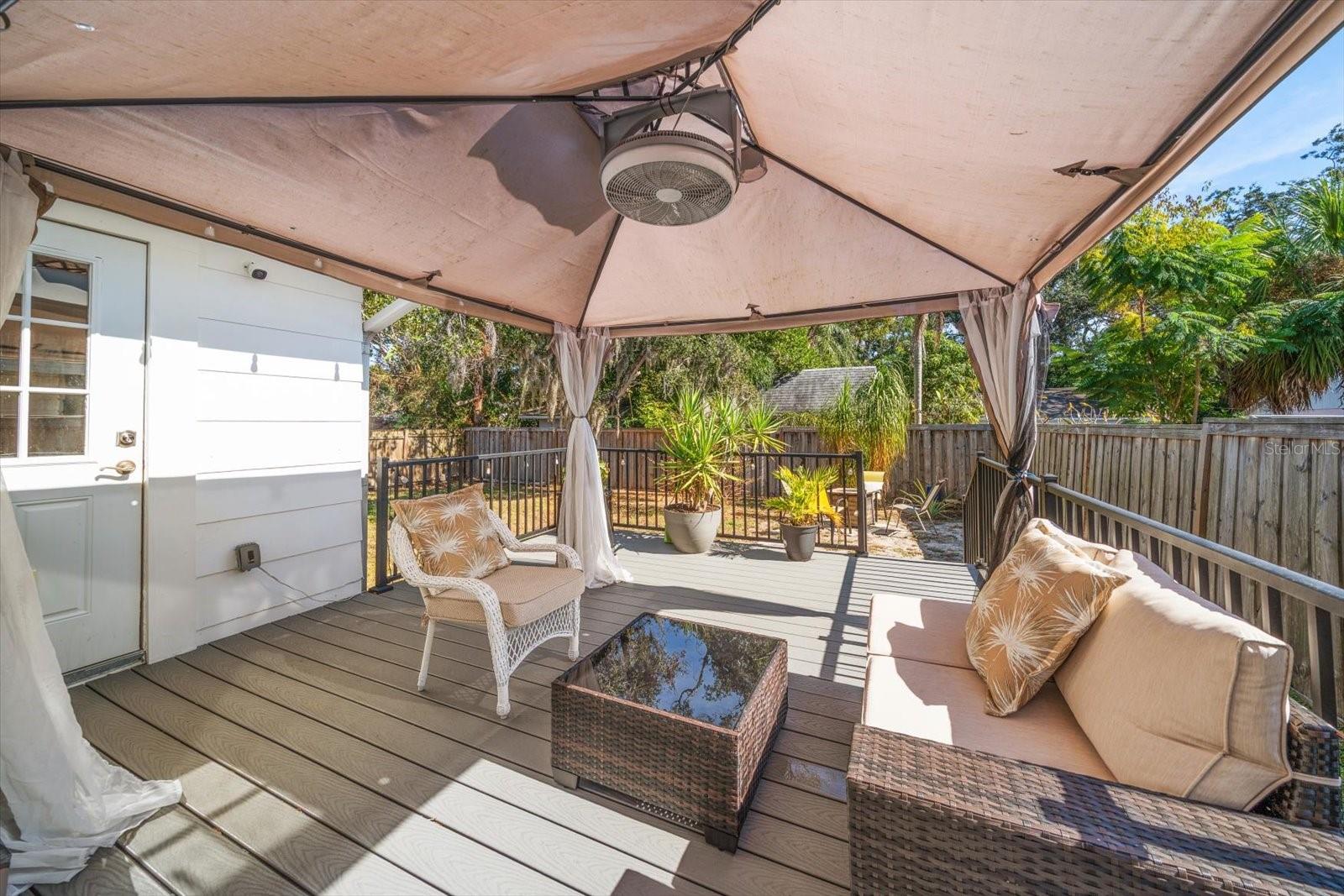 Composite deck in backyard with pergola
