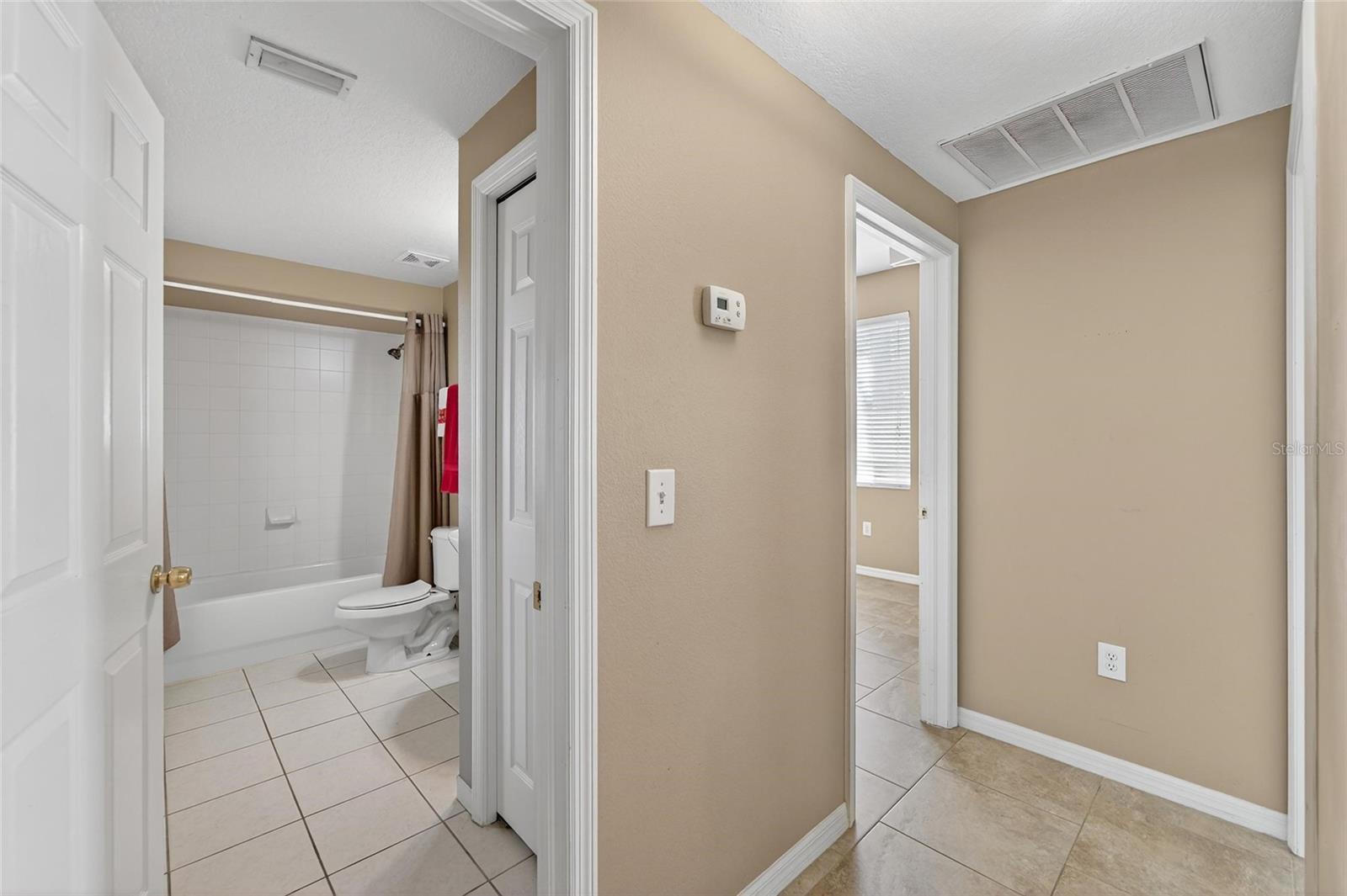 Hallway to guest bathroom & bedroom-2