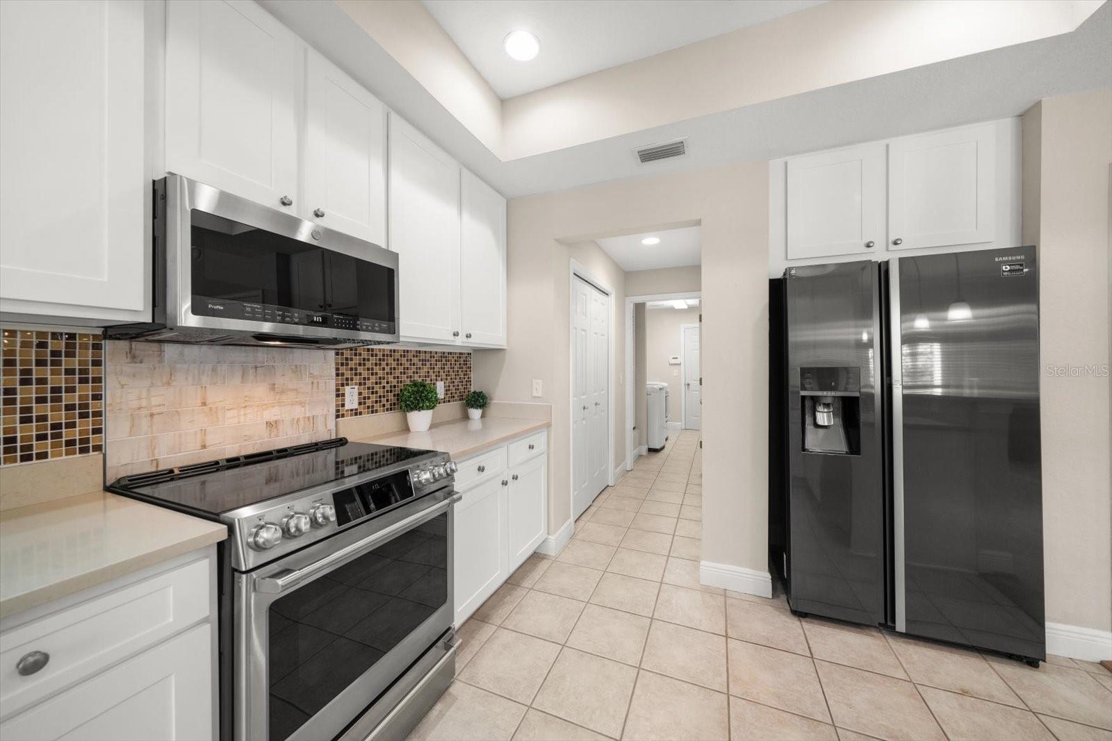 Kitchen to laundry room that leads to the garage