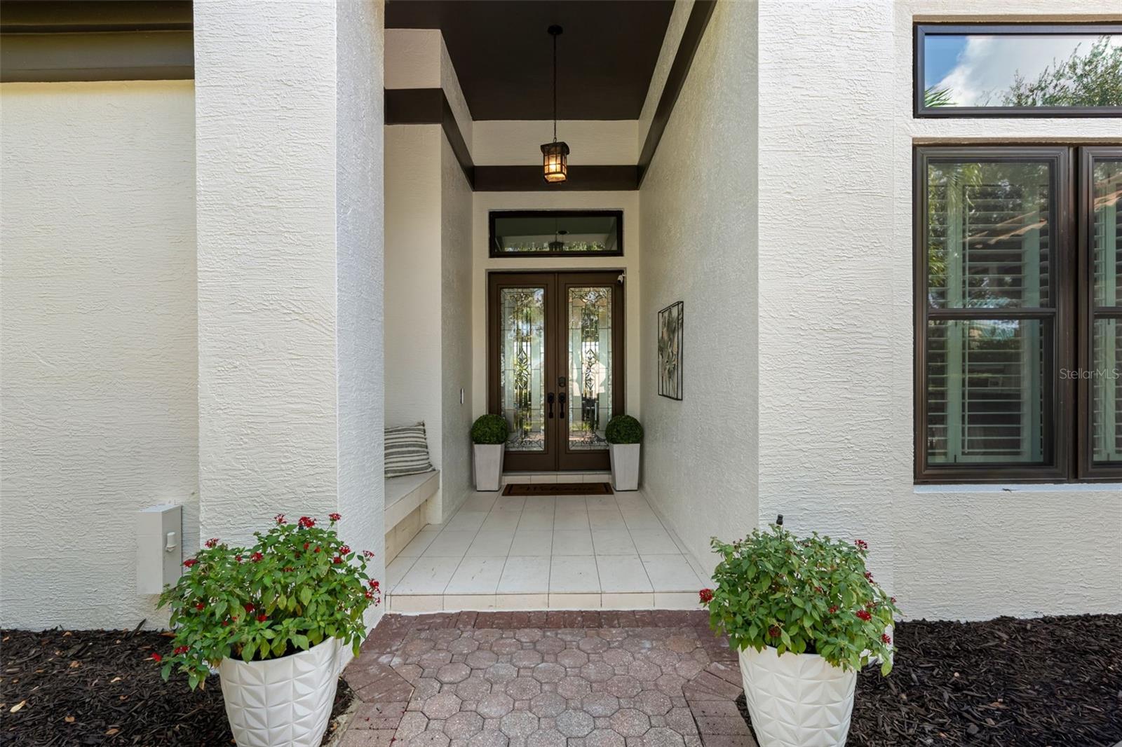 Elegant covered front entrance with classic, simple architectural lines