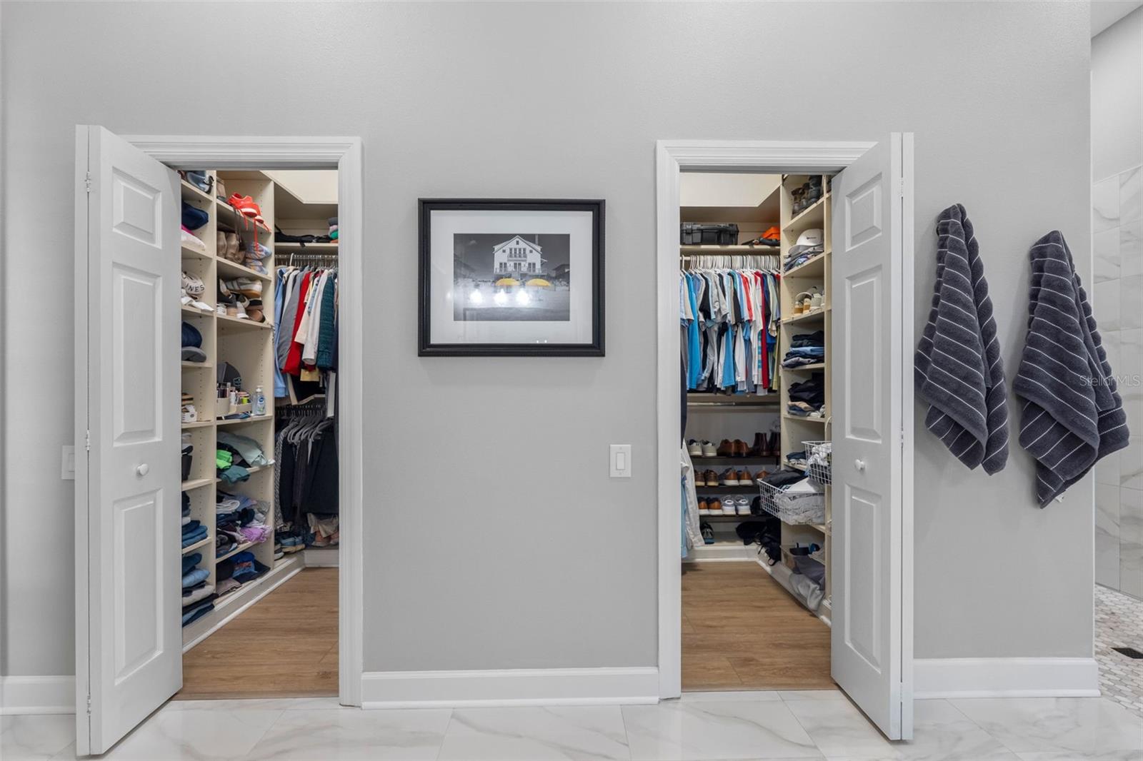 His & Hers closet with built-ins