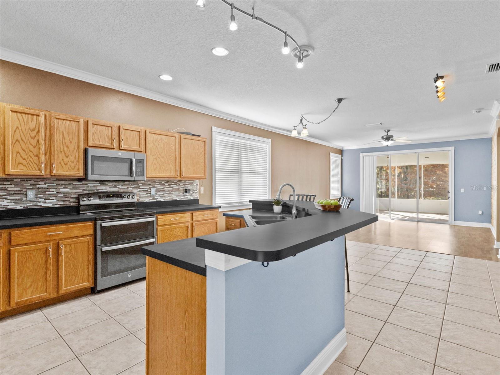 Large, open kitchen with newer GE appliances