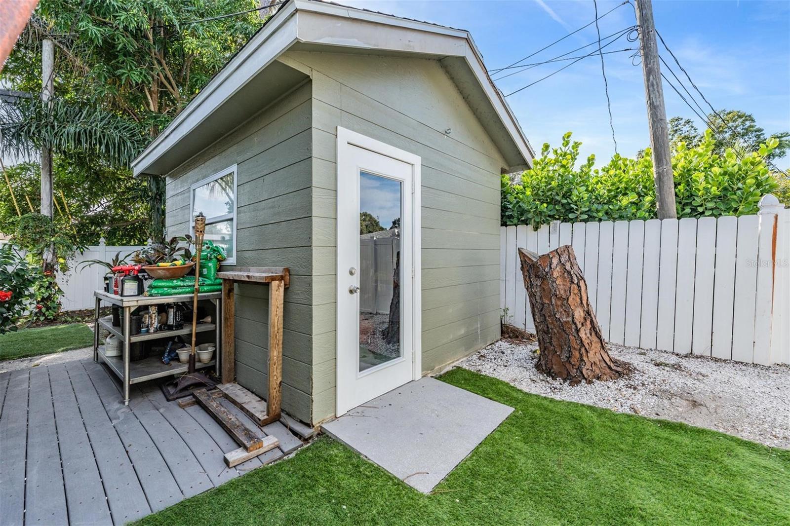 Detached storage shed with power offers space for hobbies, tools, or a workshop