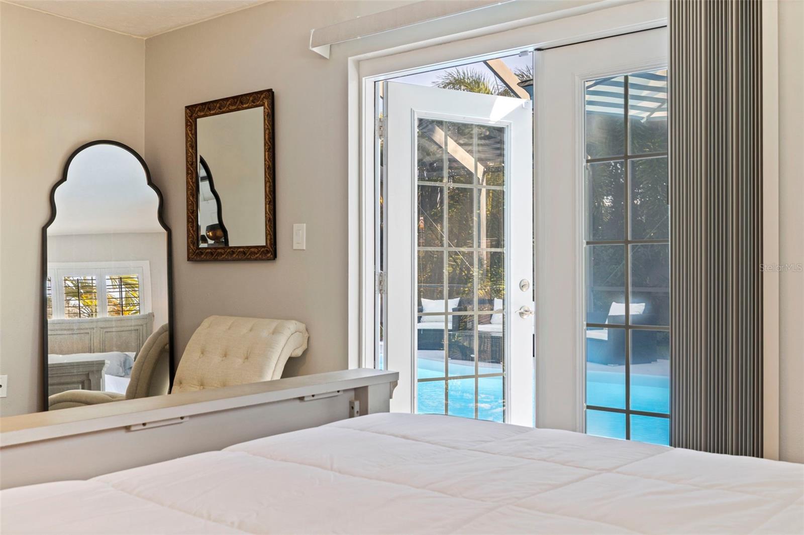 Primary bedroom French door to pool.