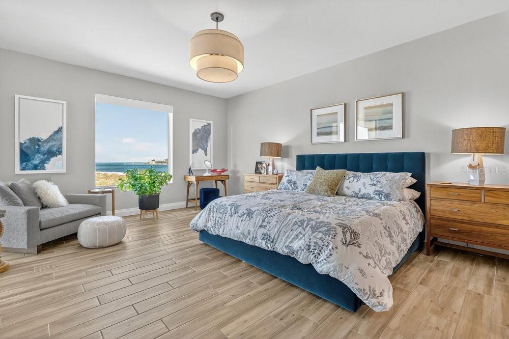 Primary bedroom with beach views.