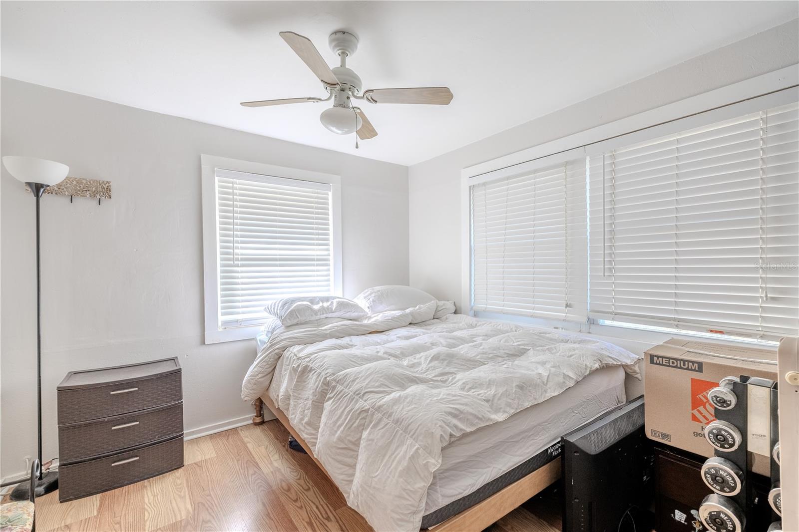 This cozy bonus room, located near the home’s front entry, offers flexible use as a guest room, home office, hobby space, or reading nook. Large windows bring in abundant natural light, creating a bright and comfortable atmosphere. The room features a ceiling fan for added comfort and neutral finishes that make it easy to personalize. Its convenient location just off the foyer adds versatility to the main living level.