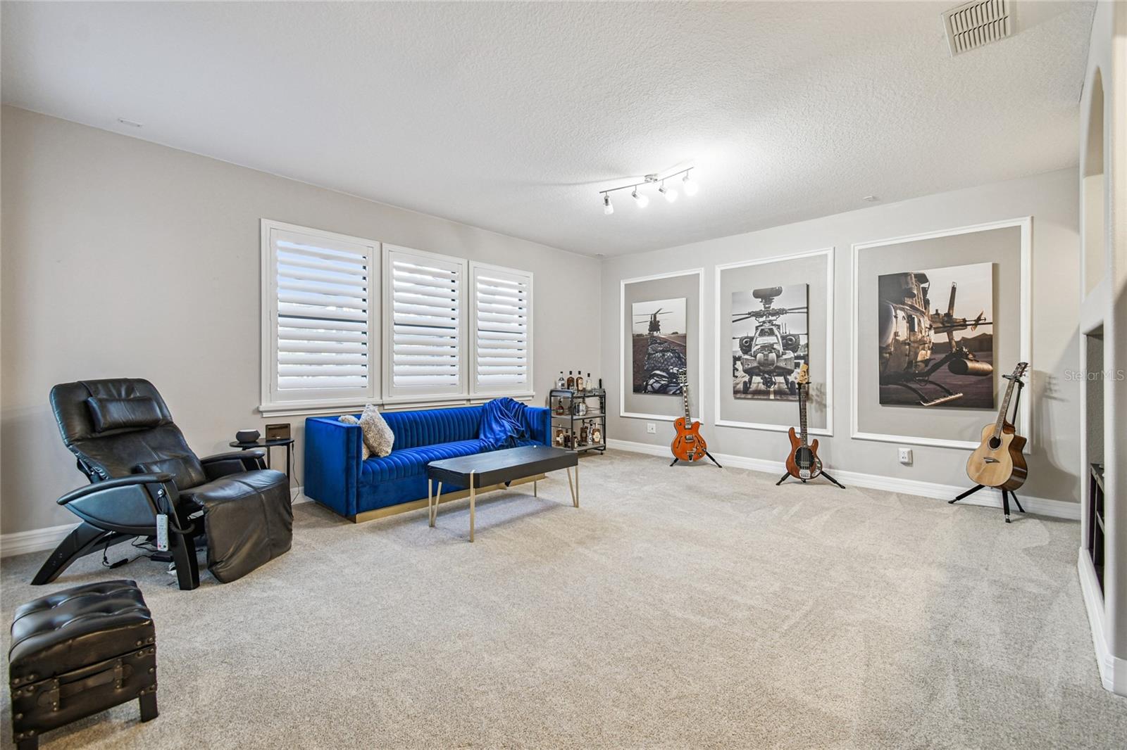 Upper level family/media room with access to balcony.